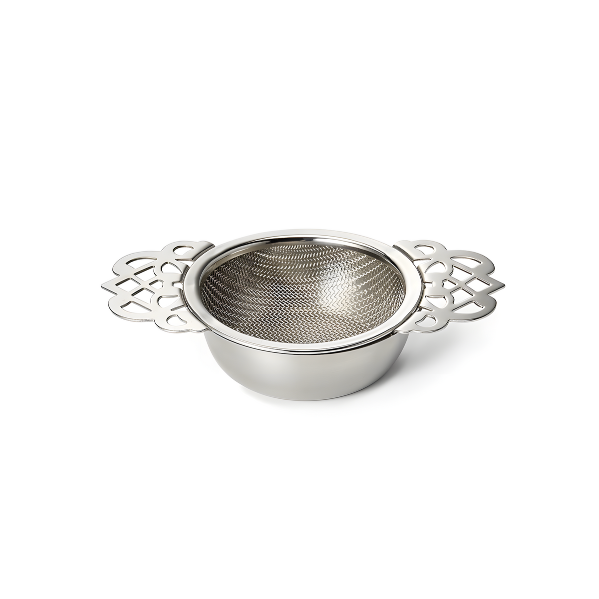 Tudor stainless steel tea strainer sitting on its matching drip bowl